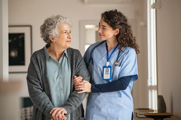 A nurse walking with a patient