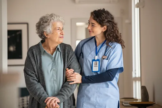 A nurse walking with a patient