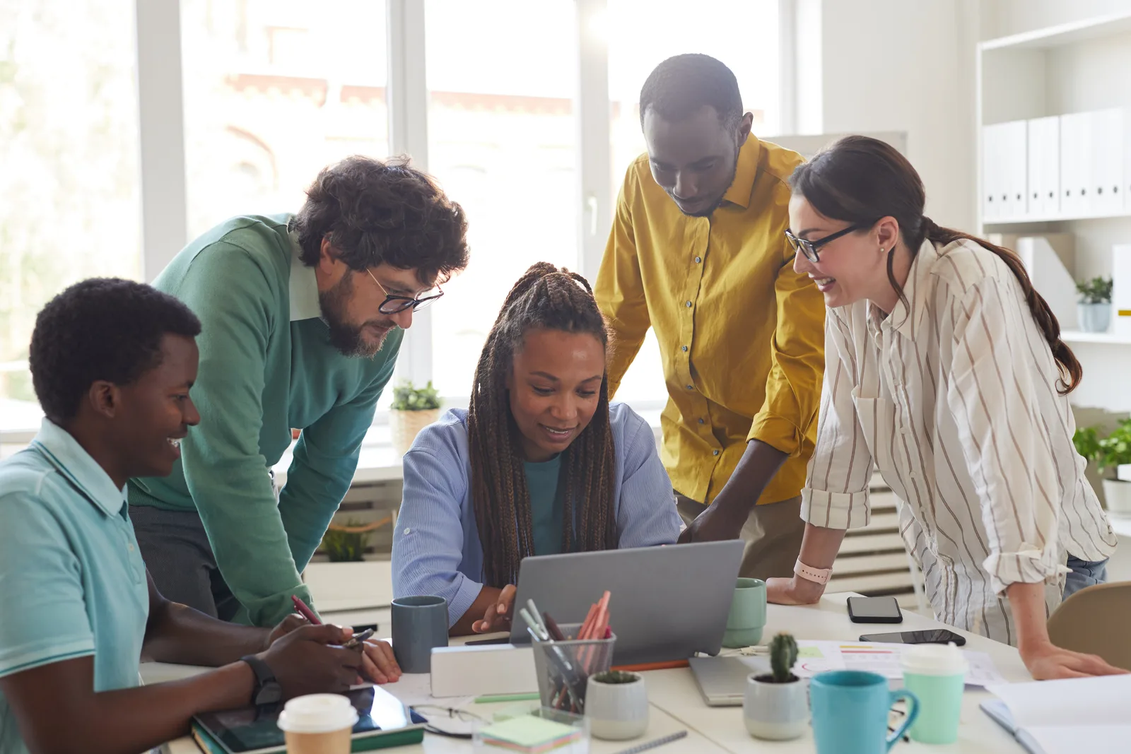 A team of Acadia employees collaborating