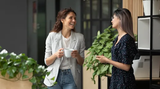 Acadia employees having a cup of coffee