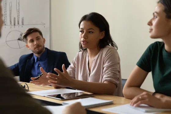 A woman leading a team meeting