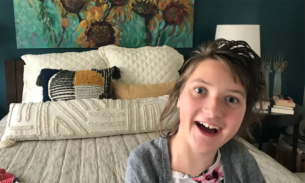 Lucy, a teenager living with Rett Syndrome