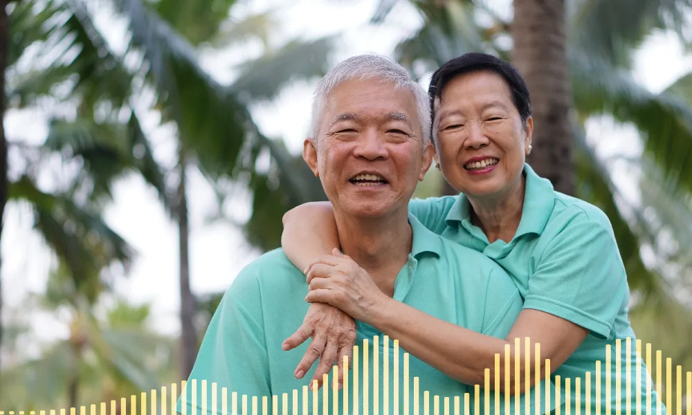 Two people smiling and hugging